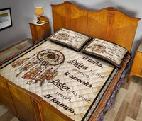 Quilt bed set with dreamcatcher center, feather accents, and two included decorative pillows