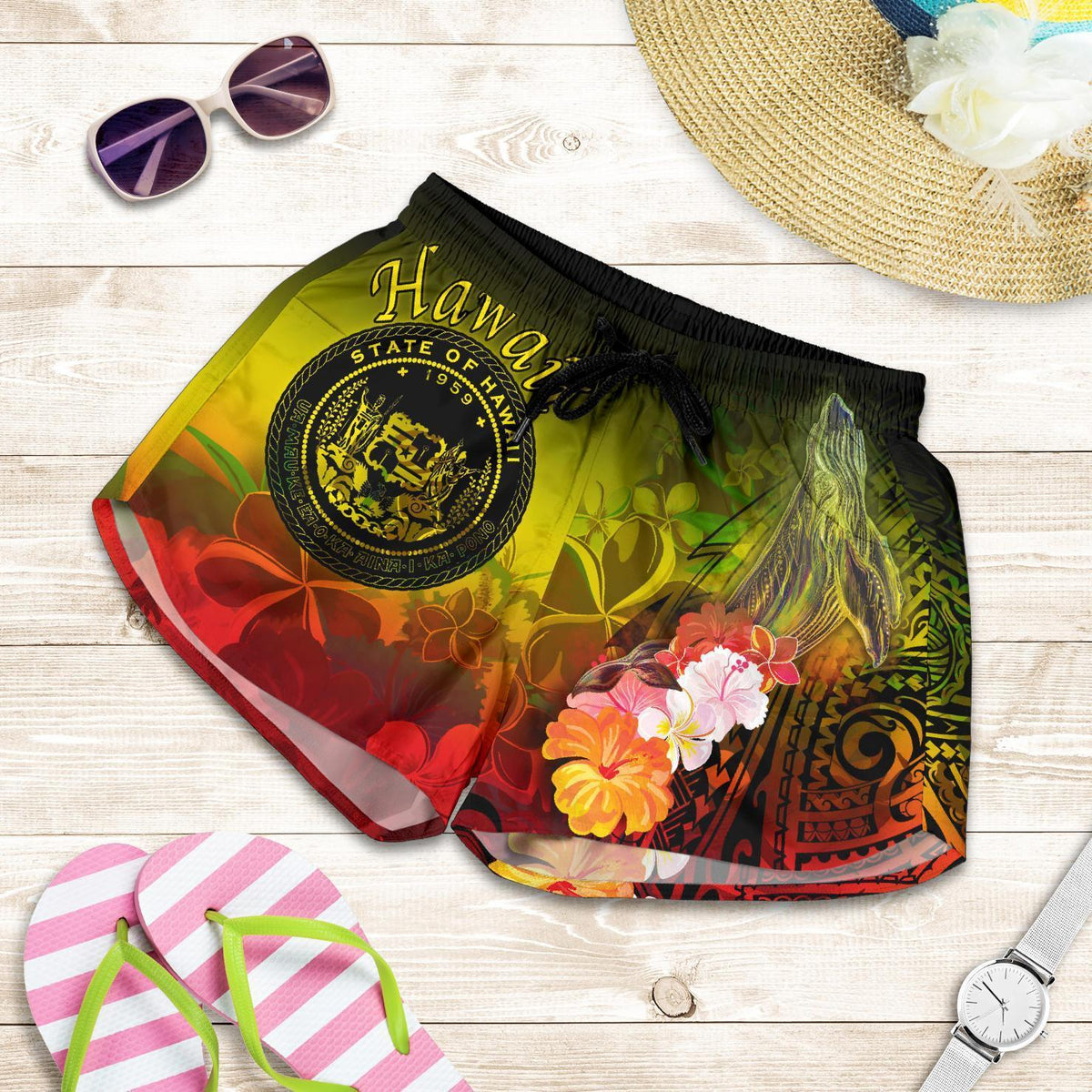 Yellow tropical floral swim shorts with elastic waist and drawstring, circular Hawaii emblem