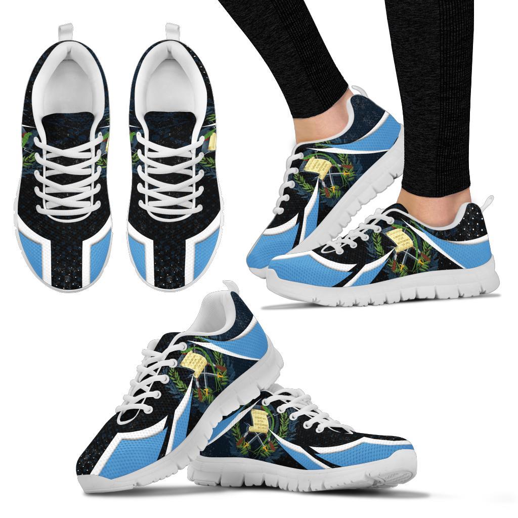 Set of black sneakers with blue accents and white laces, white outsole visible