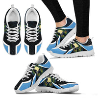 Set of black sneakers with blue accents and white laces, white outsole visible