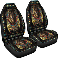 Two black car seat covers with close-up wolf head dreamcatcher graphic and tribal border