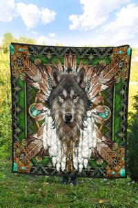 Wolf mandala quilt spread on grass, green multicolor tribal print with black border
