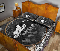 Black wolf quilt and pillows with oval patterned border and dreamcatcher web details