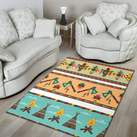 Tan and teal tribal area rug with multicolor border stripes and repeating geometric shapes