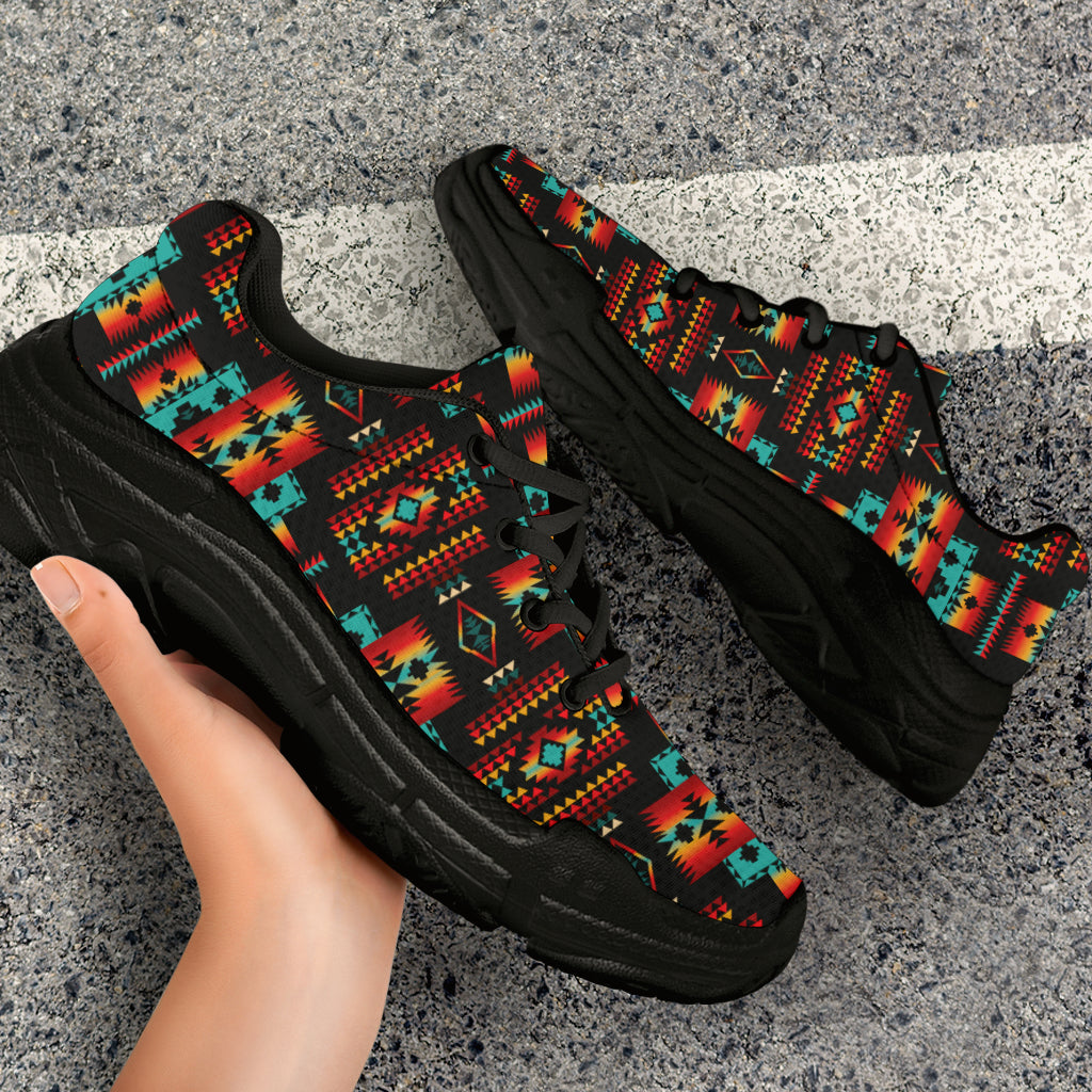 Pair of chunky sneakers with multicolor Native-style pattern and black outsole