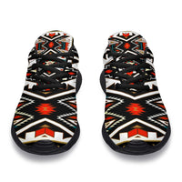 Pair of tribal patterned sneakers showing toe caps and black lace-up upper