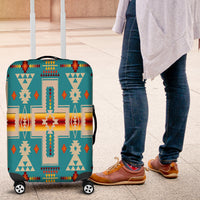 Teal luggage cover with multicolor Native geometric pattern; fitted for rolling suitcase wheels