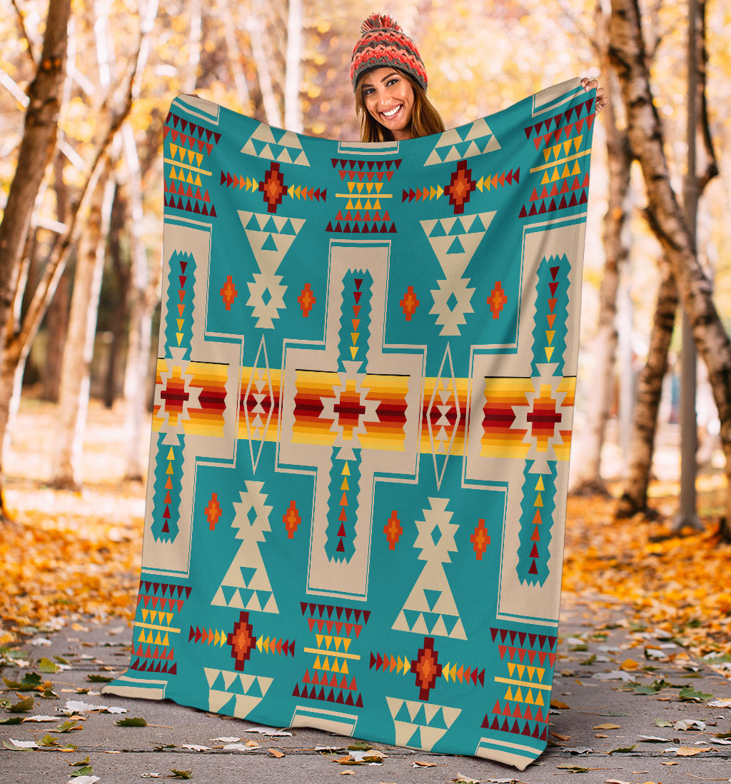 Turquoise multicolor geometric tribal blanket with central cross and diamond details