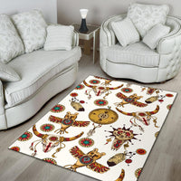 White area rug with colorful Native American animal and sun-badge pattern