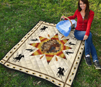 Native American chief quilt on grass: white fabric, red-yellow starburst, horses, birds, trim border