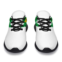 White sneakers with Brazil flag wing detail on tongue and black laces, front view