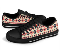 Black low-top lace-up sneakers with pink Aztec pattern vamp and white midsole stripe