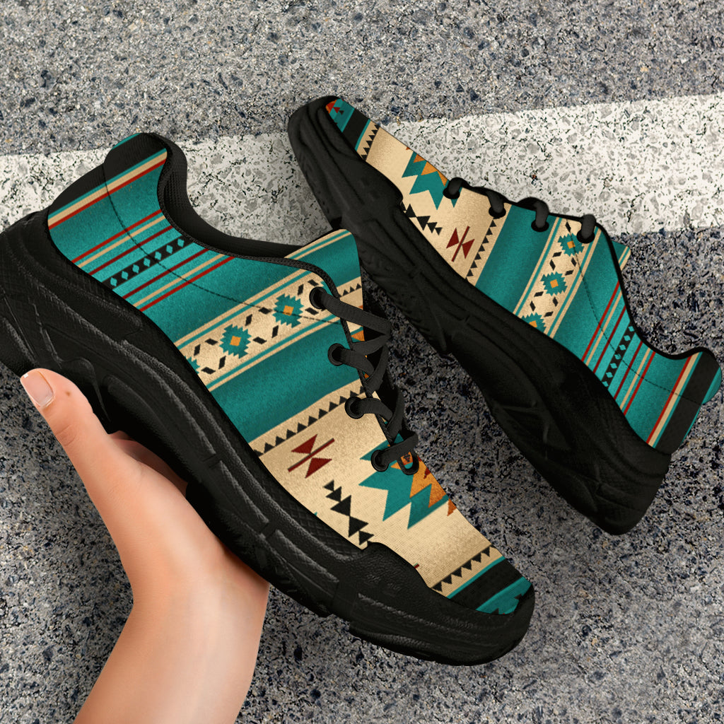 Black chunky sole and laced upper with teal/beige tribal pattern