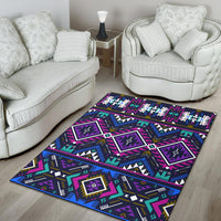 Colorful geometric area rug with purple diamond blocks, blue lines, and teal accents