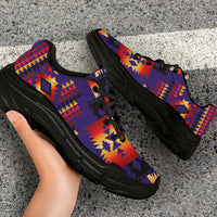 Purple lace-up chunky sneakers with Native geometric print and black outsole, close side