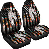 Pair of car seat covers: black base, feather design over star print, colorful stripe rows