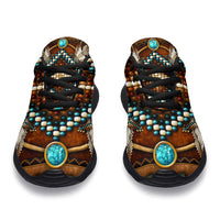 Front view brown multicolor sneakers with turquoise oval badges and black lace-up design