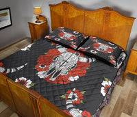 Black quilt bed set with bison face, red and white flowers; two coordinated pillowcases