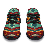 Front-facing sneakers with green-red geometric pattern, black laces and black sole