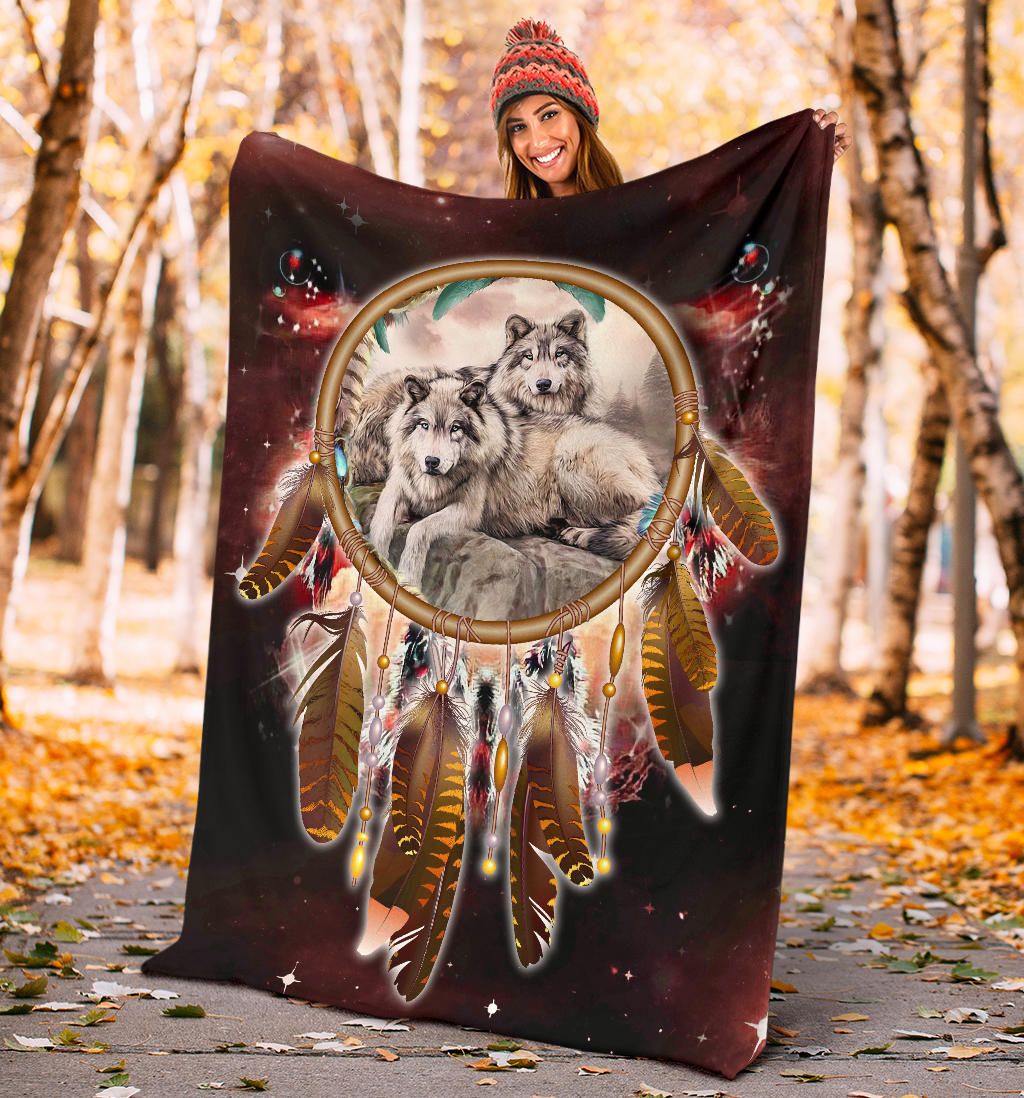Red galaxy blanket held up outdoors; three wolves with dreamcatcher ring and hanging charms