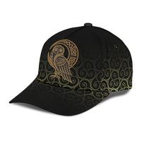 Black cap with gold Viking owl crest on side; swirling Celtic design