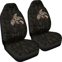 Pair of black car seat covers with Haida killer whale patch and dense geometric motif (Art)