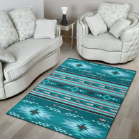 Teal rug with repeating tribal stripes and bird motifs in a bright living room