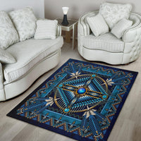 Blue native-style area rug with large central oval medallion and beaded geometric rays
