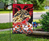 Red Albania garden flag on a hook: eagle head, red lion, and “ALB” banner