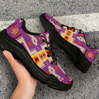 Close-up light purple tribal print sneakers with black laces and thick black sole