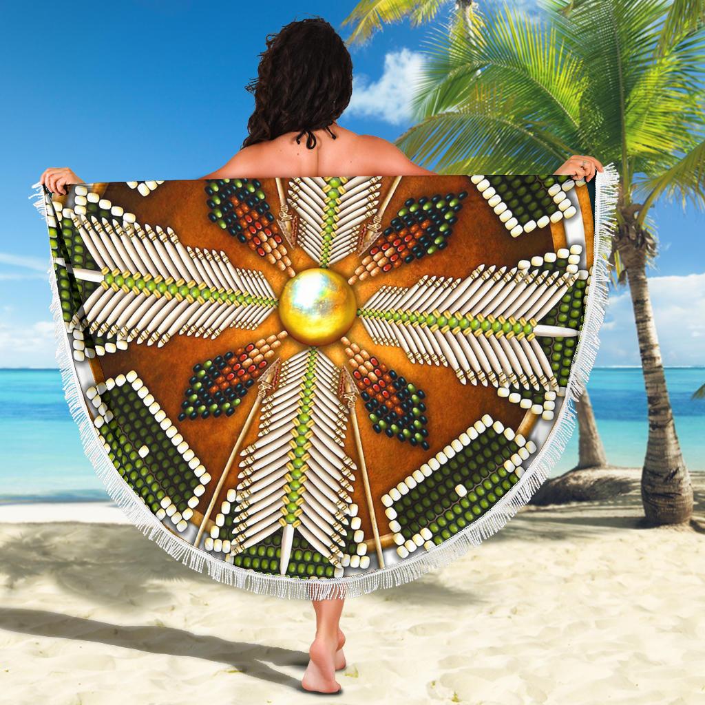 Native mandala beach blanket shown flat, green/brown radial pattern with white fringe