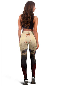 Multicolor leggings back view with medicine wheel and bison motifs, yellow/red/black