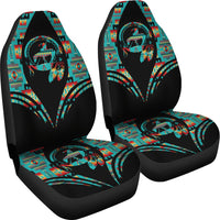 Two-piece car seat cover set with colorful teal and red artwork on black fabric