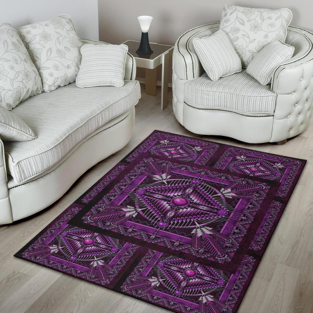 Purple geometric area rug with striped border and central starburst medallion