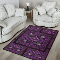 Purple geometric area rug with striped border and central starburst medallion