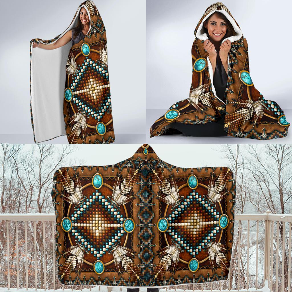 Brown hooded blanket, laid flat view with turquoise diamond medallions and fringe trim