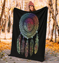Black dreamcatcher throw draped, multicolor feathers and circular mandala graphic