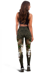 Back view of owl dreamcatcher print leggings in black and green with gold accents