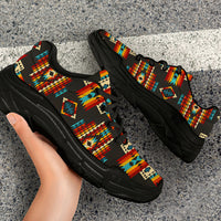 Black chunky sneakers with colorful Native American geometric print and thick black sole