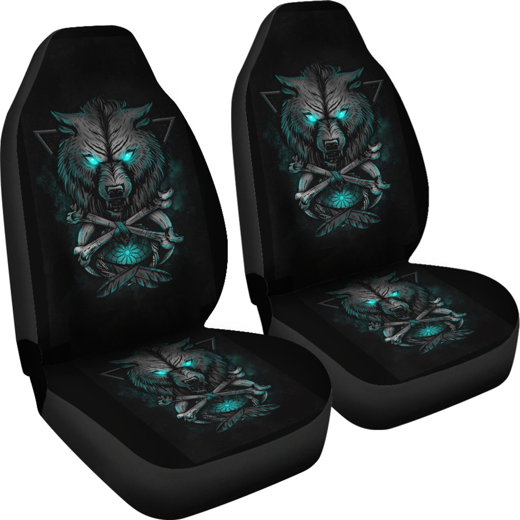 Set of black car seat covers with teal glowing wolf and crossed swords design