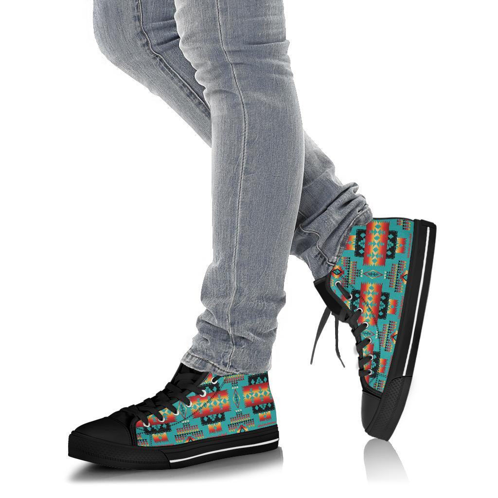 High-top Native Tribes sneakers on feet with light blue jeans, black sole