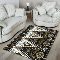 Black tribal area rug with white and gold outlined triangles and medallions