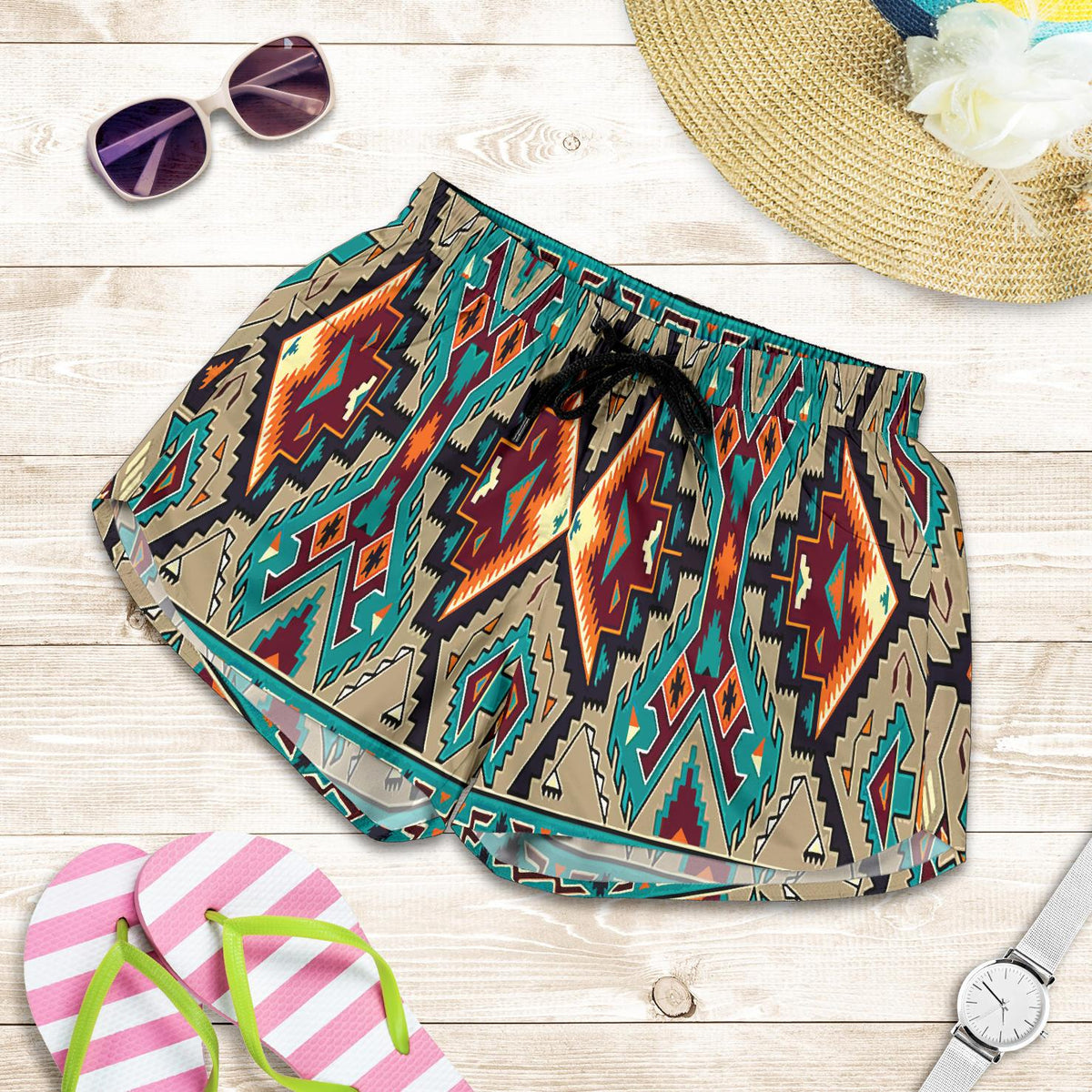 Flat-lay multicolor geometric print women’s shorts with elastic waistband and black tie front