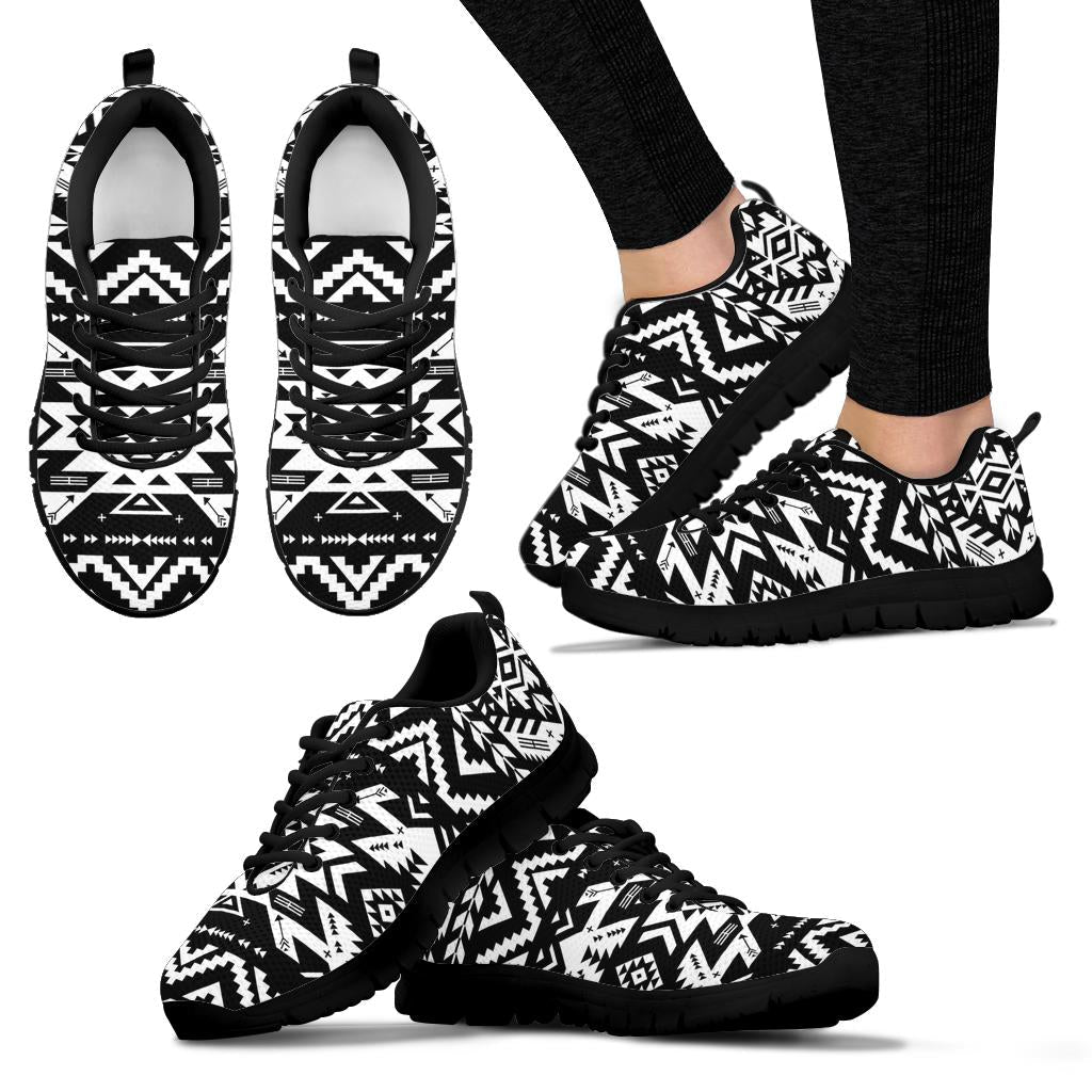 Black-and-white tribal sneakers, side view with black laces and black sole