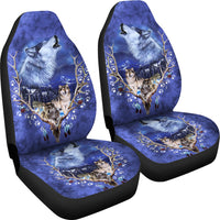 Car seat cover set with blue wolf and paw-print artwork on two seats, black edging