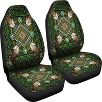 Pair of green native mandala seat covers with bead-like details and turquoise oval accents