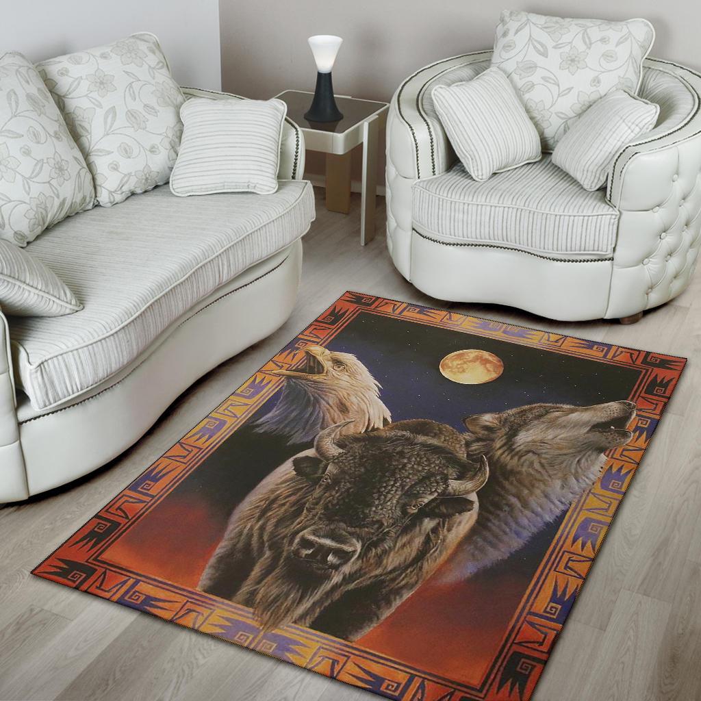 Dark area rug with eagle and bison artwork, moon circle detail, and patterned border