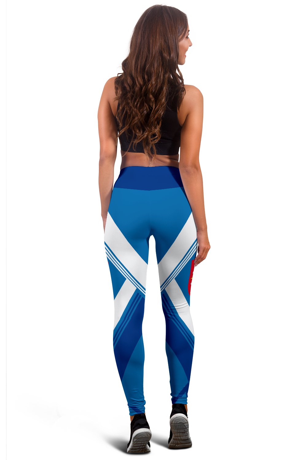 Back view of blue leggings with white chevron pattern and blocky color sections