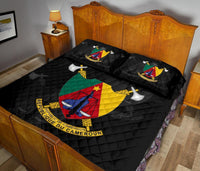 Black quilt bed set with Cameroon crest, French ribbon text, and quilted diamonds