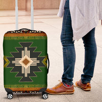 Green luggage cover with Native cross-star design and corner patterning for suitcase